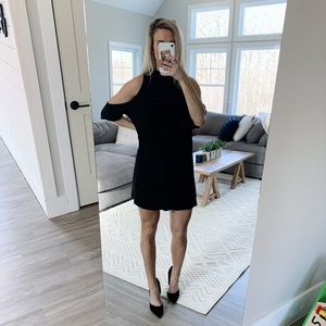 Loose fitting, open shoulder black dress